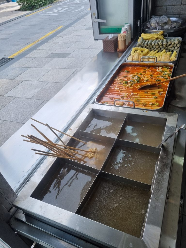Takeout rice cakes, fish cakes, and fried snacks from Seogangsoe Tteokbokki